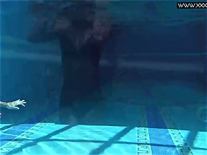 Tiffany Tatum disrobes bare underwater